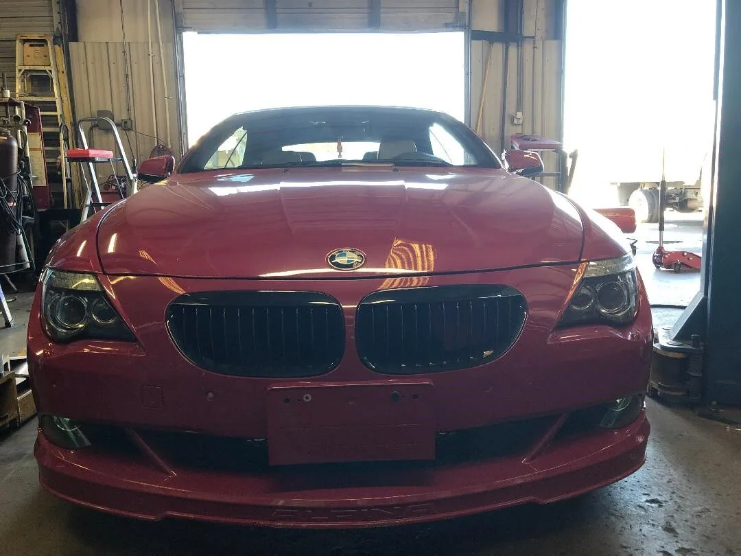 Front of a red BMW in for auto repair in West Columbia, SC