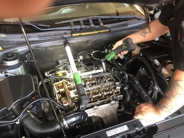 Mechanic working on an engine at Scott's Auto Repair in West Columbia, SC