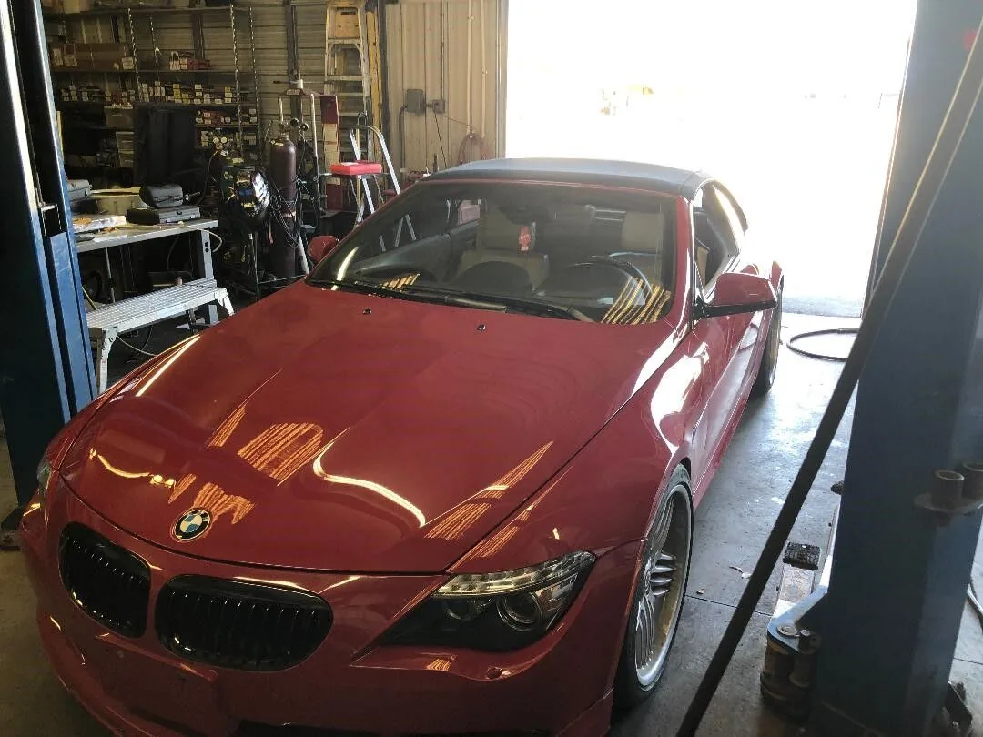 Red BMW convertible in a service bay at Scott's Auto Repair in West Columbia, SC